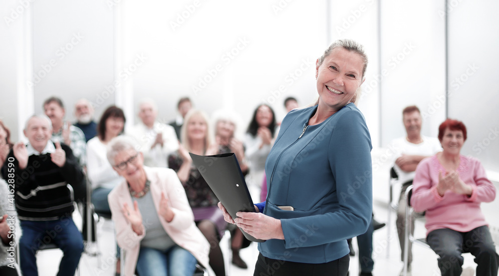 Businesswoman addressing colleagues at office meeting