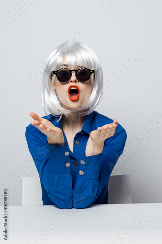 cheerful Woman in a White wig dark glasses red lips  © SHOTPRIME STUDIO
