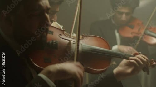 the string quartet plays classical music,medium shoot,