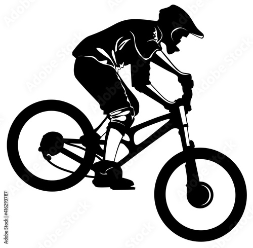 Silhouette of a cyclist riding a mountain bike