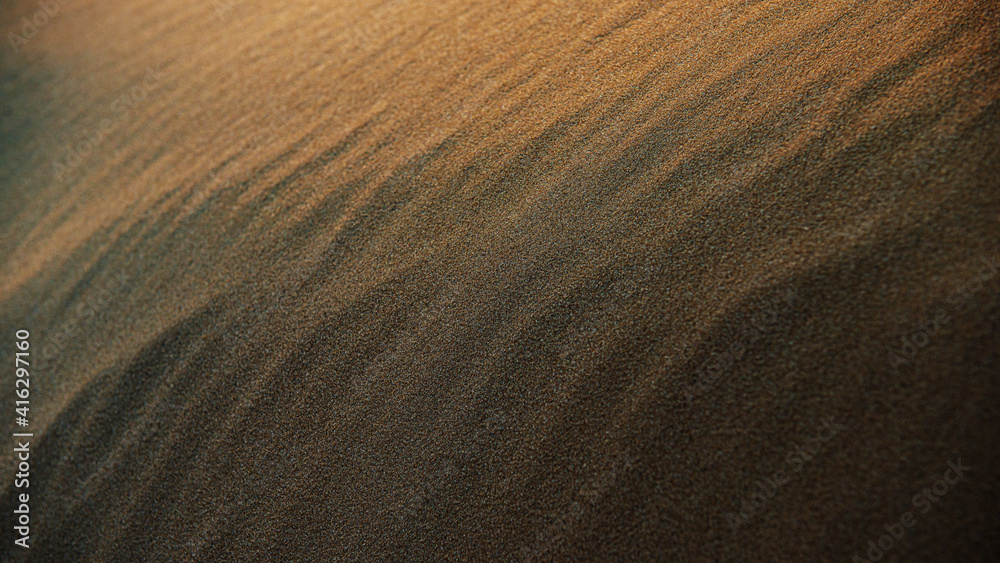 Fototapeta premium dark sand surface in dunes at sunset.
