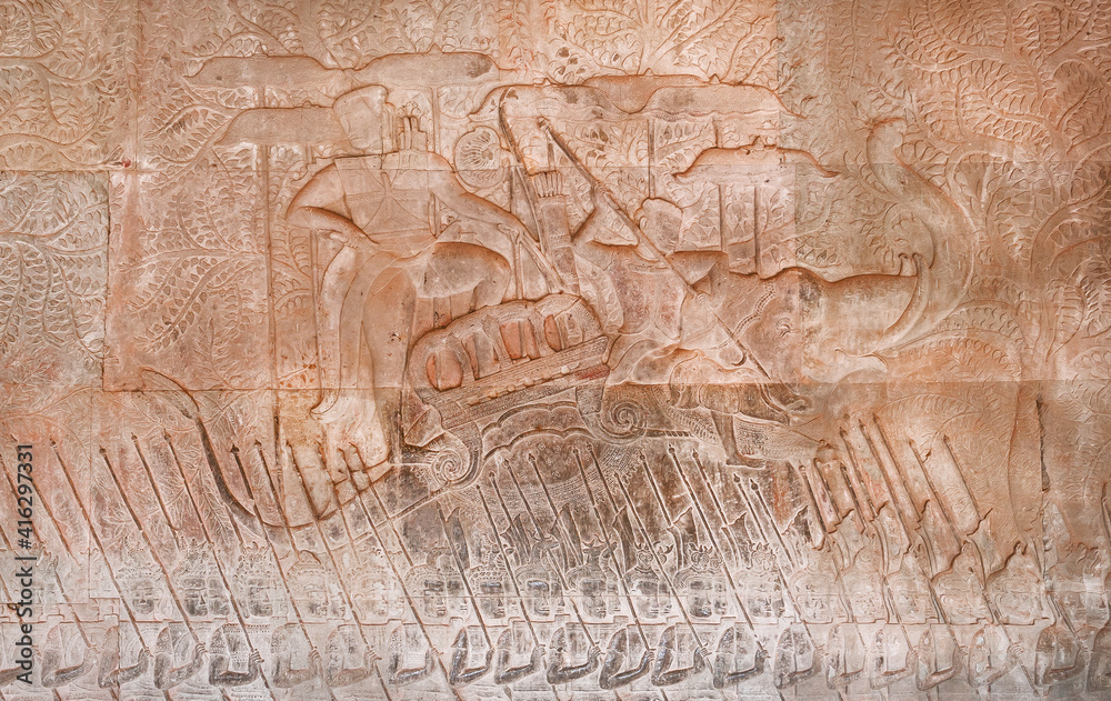 Historical art with relief of King Suryavarman II, the builder of Angkor Wat on army boat. Walls of Angkor What temple, 12th century Khmer landmark. Cambodian complex and UNESCO World Heritage Site