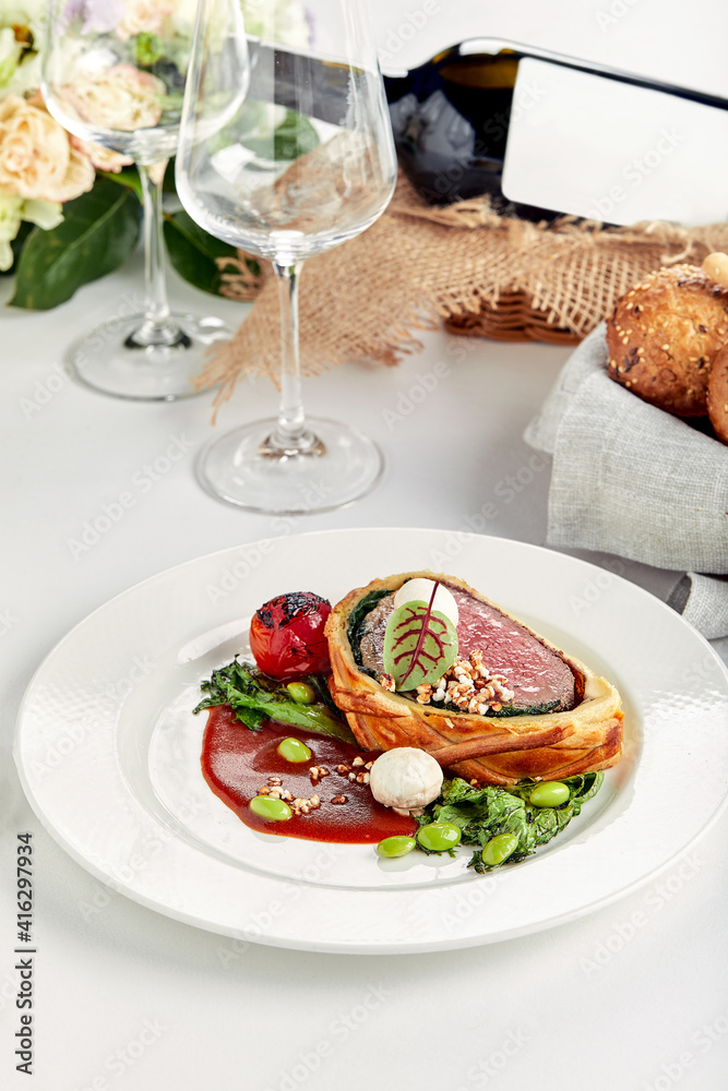 Easter meat roll, meatloaf for Easter dinner. Beautifully decorated catering banquet table with different food snacks and appetizers