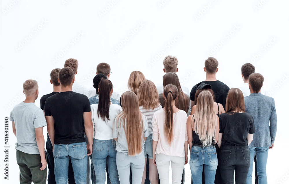 rear view. group of young people standing in front of blank screen