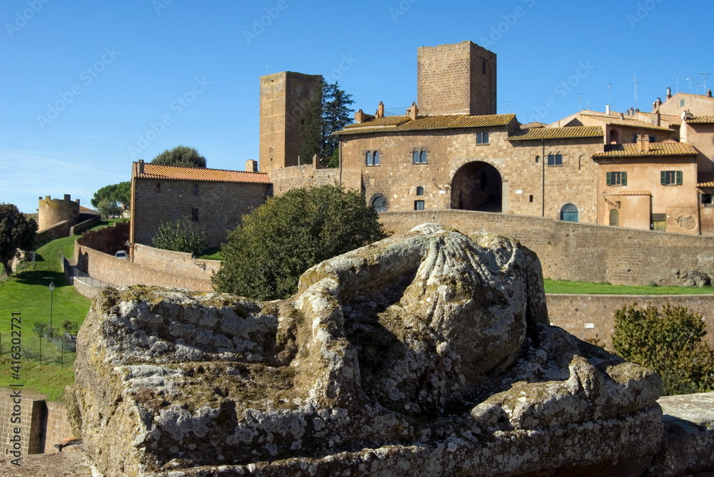 View of Tuscania from Bastianini Square and Etruscan sarcophagus, Latium View of Tuscania from Bastianini Square and Etruscan sarcophagus, Latium