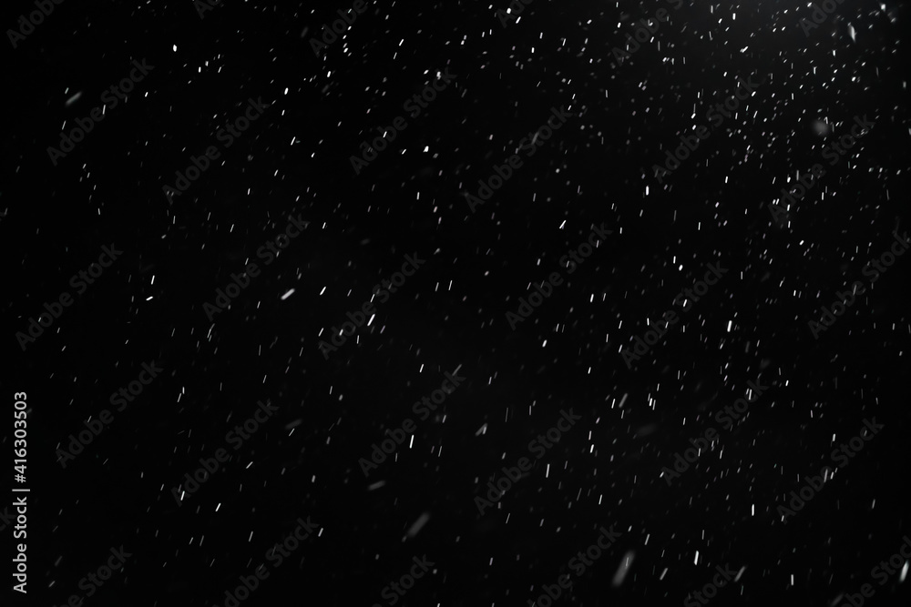 Snow on a black background. Snow background. Christmas, New Year background