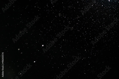 Snow on a black background. Snow background. Christmas  New Year background