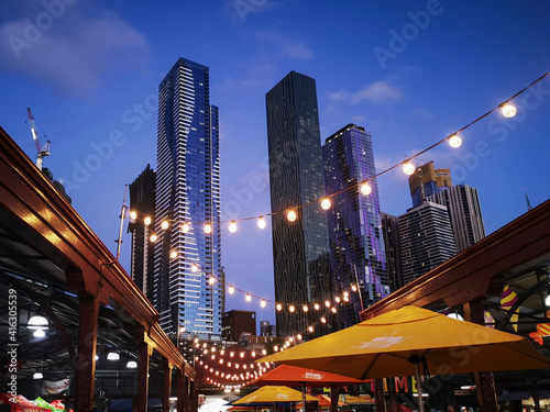 Melbourne\'s famous Summer Night Market selling only ethnic food and drink - every Wednesday at Victoria Market. Melbourne Cityscape background.