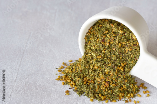 Fototapeta Naklejka Na Ścianę i Meble -  Mixed spice zaatar or zatar in ceramic bowl . Closeup