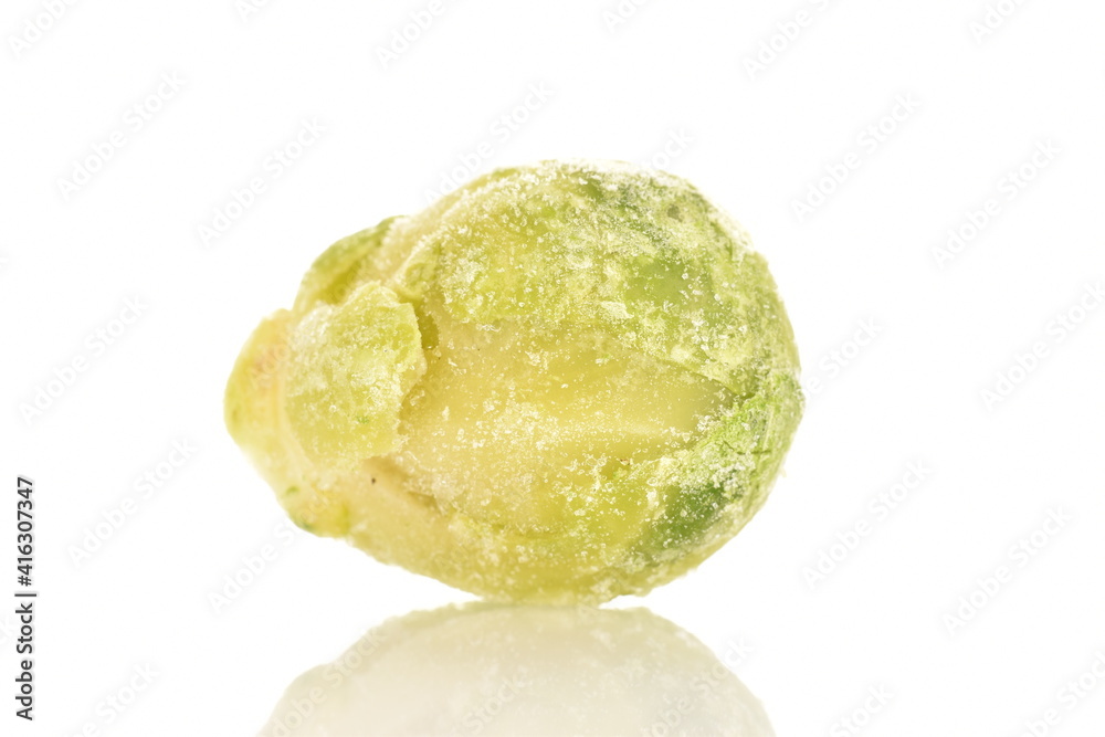 One frozen Brussels sprouts, close-up, isolated on white. One frozen Brussels sprouts, close-up, isolated on white.