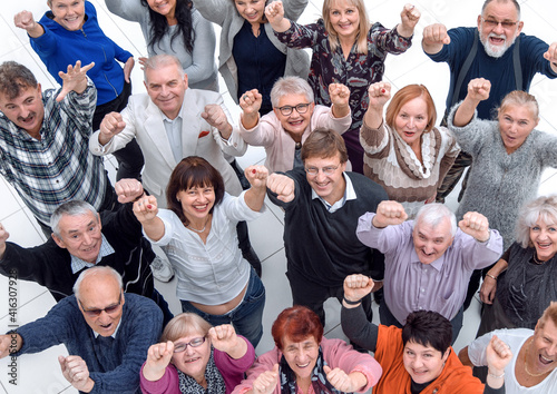 group of confident mature people showing their success