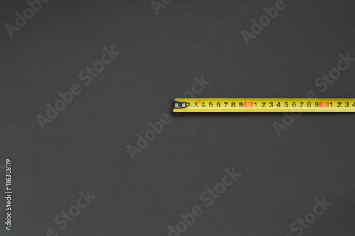yellow ruler on black background