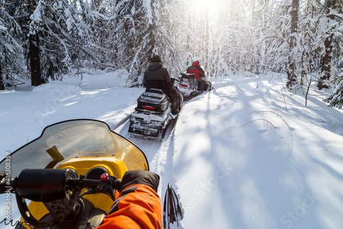 Athletes on a snowmobiles.