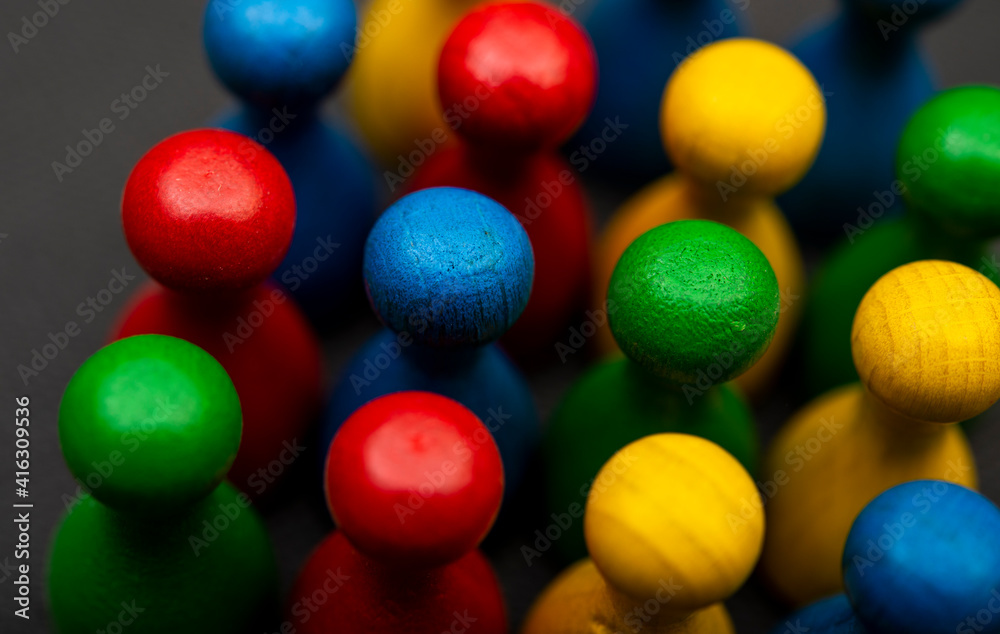 Naklejka premium Team concept shown with multi color pawns closeup view