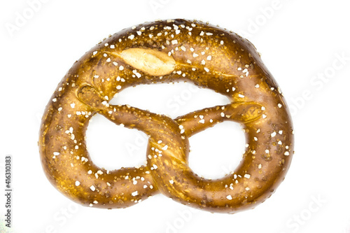 Bavarian pretzel with salt isolated on white background top view