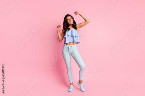 Full size photo of young attractive lovely happy positive excited afro girl dancing isolated on pink color background © deagreez