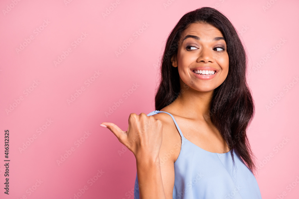 Profile photo of optimistic brunette lady point look empty space wear blue top isolated on pink color background Profile photo of optimistic brunette lady point look empty space wear blue top isolated on pink color background