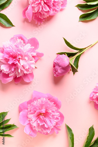 Fototapeta Naklejka Na Ścianę i Meble -  Floral vertical pattern of pink peony flowers on pink background. Greeting card for 8th March or Mother day.