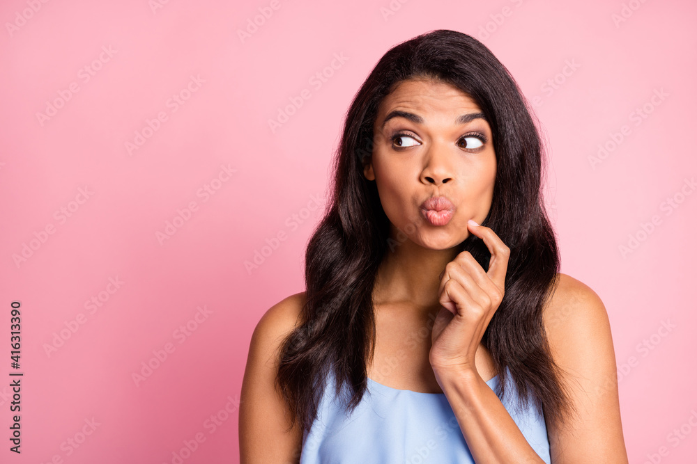 Portrait of optimistic brunette lady finger face look empty space wear blue top isolated on pink color background Portrait of optimistic brunette lady finger face look empty space wear blue top isolated on pink color background