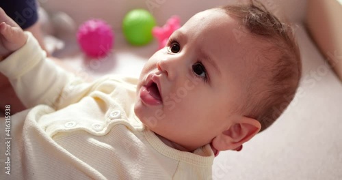 Hands of mom giving cough syrup medicine on spoon to sick little son. health and medicine baby concept. slow motion