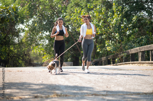  Asian women running with dog