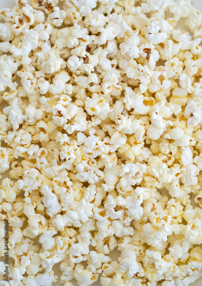 Background and texture of popcorn close up Background and texture of popcorn close up