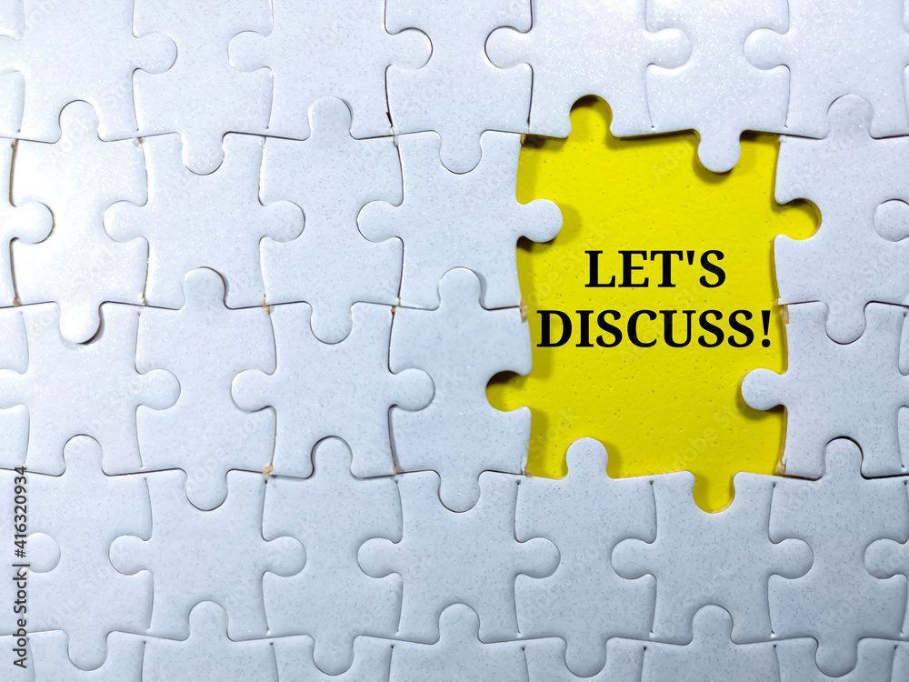 Obraz premium Selective focus.Word LET'S DISCUSS with jigsaw puzzle on yellow background.Business concept.