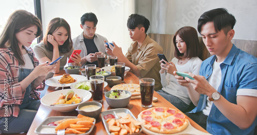 phubbing concept in dine together photo