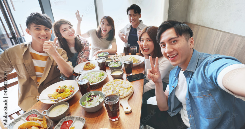 friends take selfie in restaurant friends take selfie in restaurant