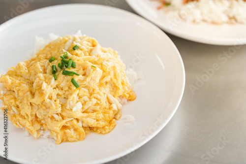 Creamy Omelet with Crab meat on Rice in white plate. dish Most popular menus in Thailand.Thai Asian style food. Copy space