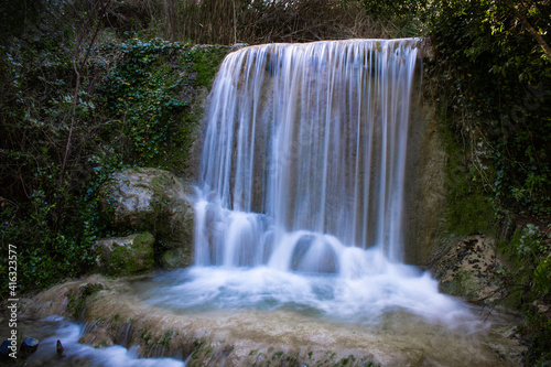 Waterfall of Quiaios in Portugal  also known as Cascata de Quiaios near Figueira da Foz  a beautiful and peaceful natural hidden spot in the woods. Long exposure photo of small cascade