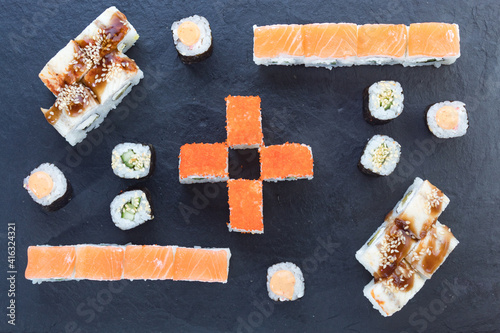 Assorted from the roll. Japanese cuisine. rolls on a stone platter. serving the table. view from above.