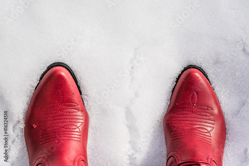 cowboy or cowgirl western style boots in the snow