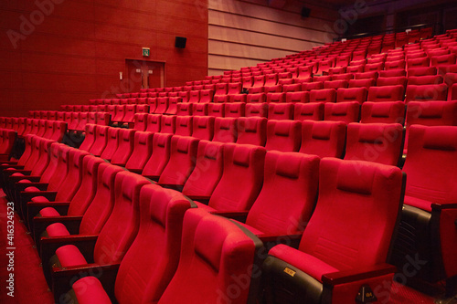 Red chairs in an empty concert hall