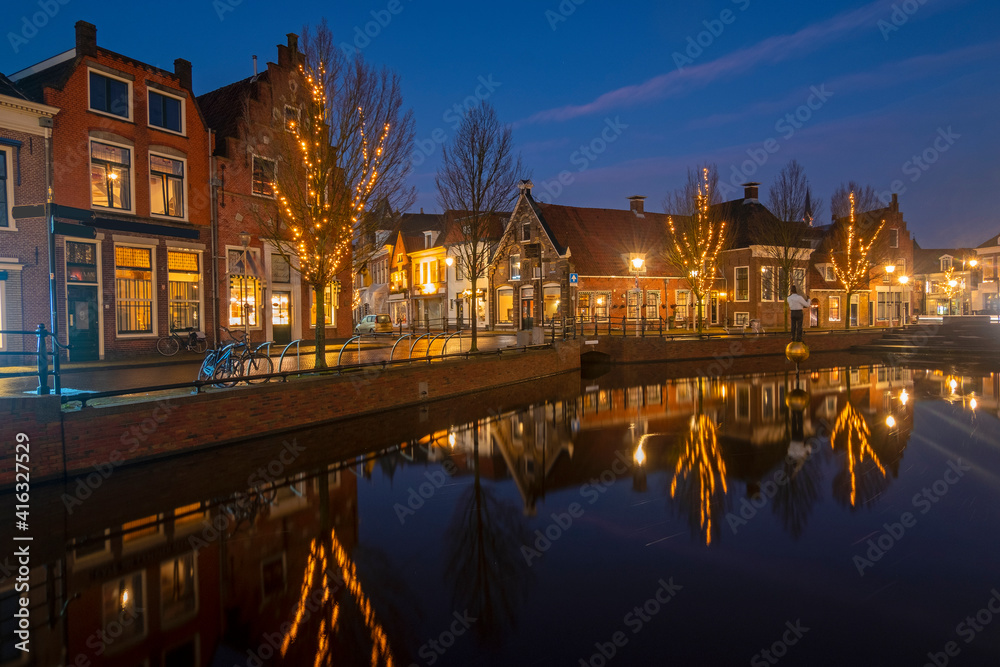 Fototapeta premium View on the city Sneek with christmas in the Netherlands at sunset
