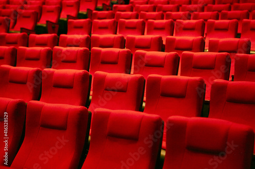 Red chairs in an empty concert hall