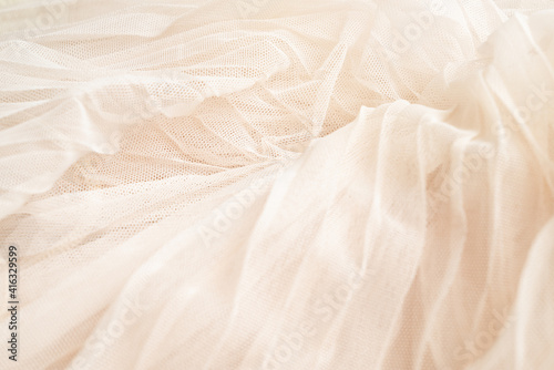 Tulle fabric Ivory colored texture. Textile background