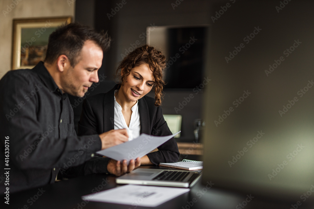 Doing paper work together, team work. Doing paper work together, team work.