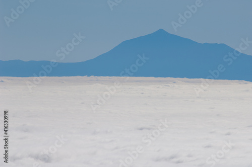 Sea of clouds and island of Tenerife with the Teide peak from La Palma. Canary Islands. Spain.