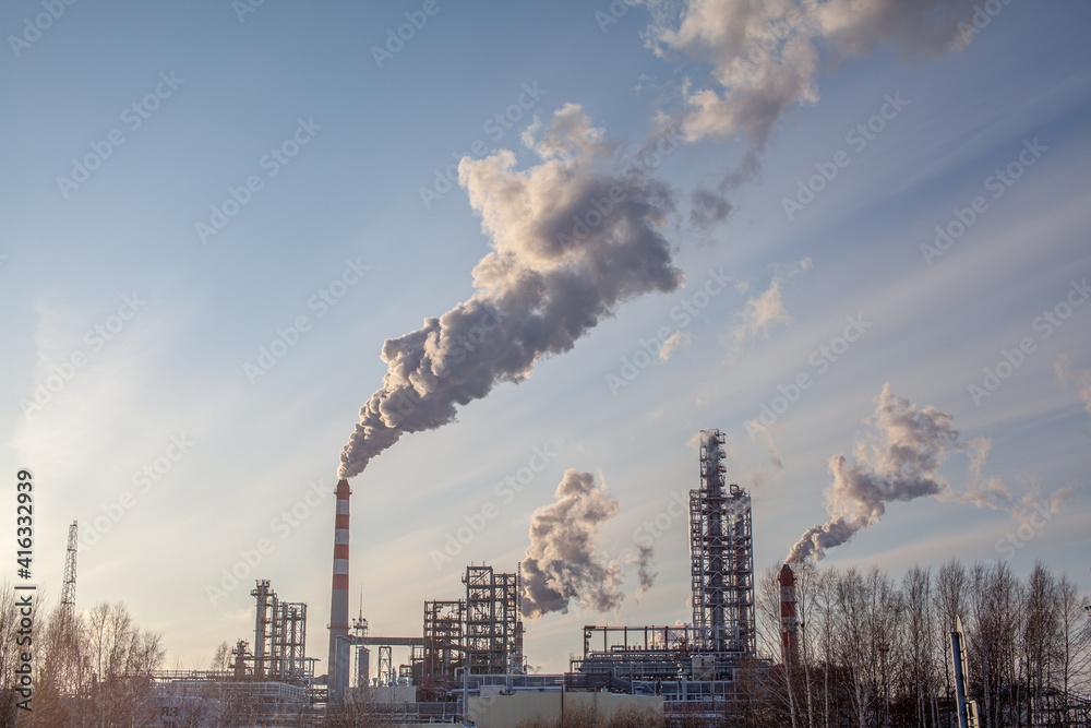 The work of a petrochemical plant. Smoke is coming from the chimney.