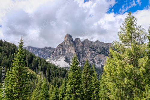 Mountain range of the Italian Dolomites surrounded by forest. Trentino-Alto Adige, Italy