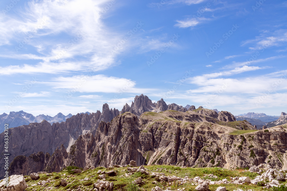 Mountain peaks of the Italian Dolomites and beautiful blue sky. South Tyrol, Italy