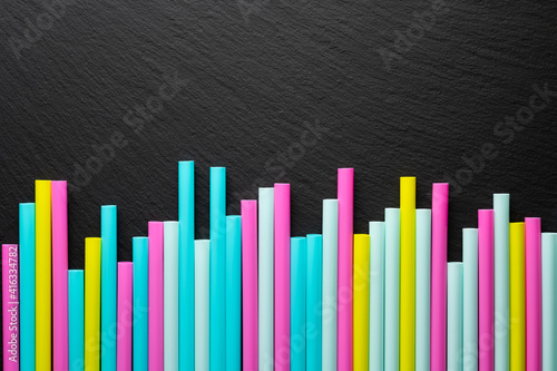 abstract background of slate texture and cocktail tubes