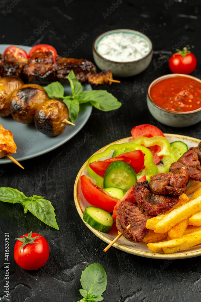 Kebap, roasted meat and vegetables on grill