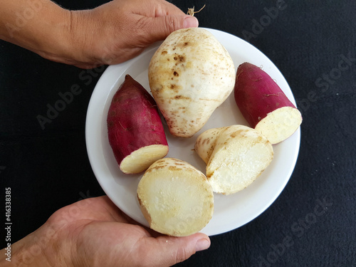 Red Sweet potatoes and white sweet potatoes, name binomial  (Ipomoea batatas) with light skin, Convolvulaceae family. Manaus – Amazon, Brazil. photo