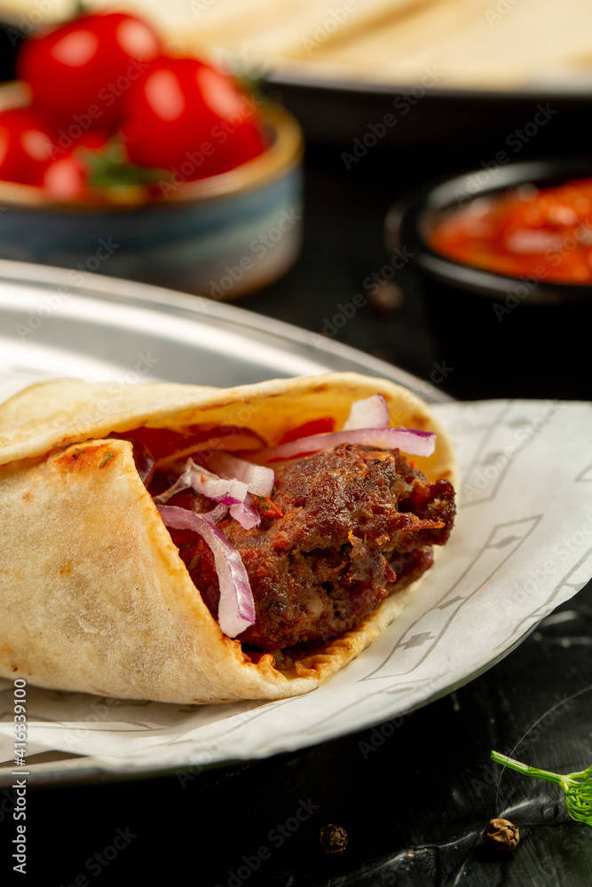 Kebap wrapped in a very thin pita or lavash 