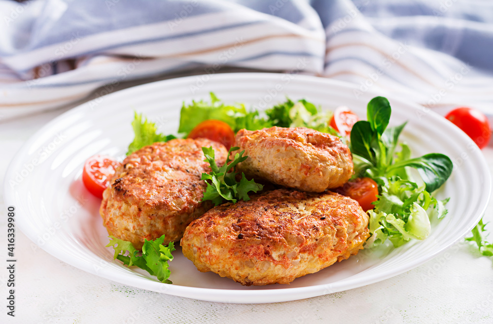 Meatballs with cabbage. Lazy cabbage rolls with fresh salad on light background. Russian cuisine. Meatballs with cabbage. Lazy cabbage rolls with fresh salad on light background. Russian cuisine.