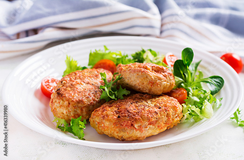 Meatballs with cabbage. Lazy cabbage rolls with fresh salad on light background. Russian cuisine.