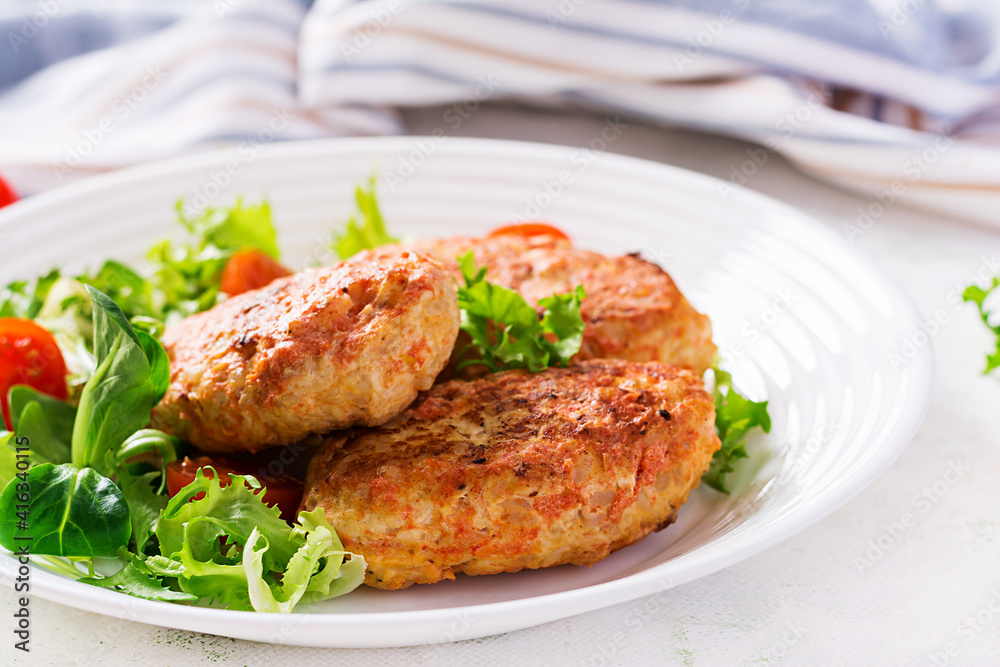 Meatballs with cabbage. Lazy cabbage rolls with fresh salad on light background. Russian cuisine.