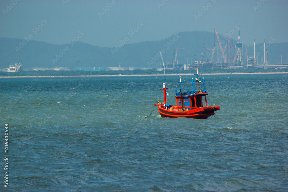 A red fishing boat in the sea